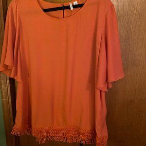 Orange loose fitting blouse with fringed bottom